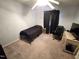 Small bedroom with basic furnishings including a bed, desk, and office chair at 1545 N Nc 87, Elon, NC 27244