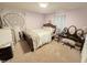 Bedroom featuring stylish decor, a comfortable bed, and soft natural light at 1545 N Nc 87, Elon, NC 27244