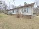 Charming single-story home with blue shutters and low maintenance landscaping at 1545 N Nc 87, Elon, NC 27244