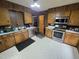 Cozy kitchen features stainless steel appliances, wood cabinets, and durable countertops at 1545 N Nc 87, Elon, NC 27244