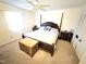 Primary bedroom with a poster bed, neutral carpet, and a window at 1545 N Nc 87, Elon, NC 27244