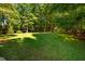 Expansive backyard with mature trees offering ample shade at 1616 Kirkby Ln, Raleigh, NC 27614