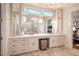 Elegant bathroom with dual vanities, granite countertops, herringbone tile flooring, and recessed lighting at 1616 Kirkby Ln, Raleigh, NC 27614