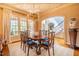 Light-filled dining room boasts unique ceiling details and a view of the staircase, blending charm and functionality at 1616 Kirkby Ln, Raleigh, NC 27614