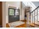 Bright foyer with hardwood floors, double doors, and staircase, offering a grand entrance at 1616 Kirkby Ln, Raleigh, NC 27614