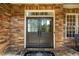 Elegant double front doors with stone accents, leading to a spacious foyer at 1616 Kirkby Ln, Raleigh, NC 27614