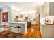 Bright, open kitchen with marble countertops, stainless steel appliances, and a central island with bar seating at 1616 Kirkby Ln, Raleigh, NC 27614