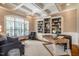 Sophisticated home office with custom built-in bookshelves, coffered ceiling, and ample natural light at 1616 Kirkby Ln, Raleigh, NC 27614