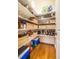 Organized walk-in pantry with ample shelving, wooden crates, and stylish storage solutions at 1616 Kirkby Ln, Raleigh, NC 27614