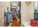 Well-organized walk-in closet with clothing racks, shelves, and a cozy bench for added convenience at 1616 Kirkby Ln, Raleigh, NC 27614
