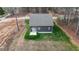 Aerial view of a home featuring a modern backyard, set in a quiet, wooded neighborhood at 163 Nashua Dr, Louisburg, NC 27549