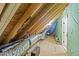 Unfinished attic space with exposed wood rafters, and insulation and HVAC ductwork at 163 Nashua Dr, Louisburg, NC 27549