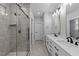 Bathroom featuring a walk-in shower, double sink vanity and neutral paint at 163 Nashua Dr, Louisburg, NC 27549