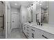 Bathroom featuring a double sink vanity, neutral paint and a view of the walk-in shower at 163 Nashua Dr, Louisburg, NC 27549