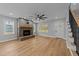 Spacious living room with a brick fireplace, and bright natural light at 163 Nashua Dr, Louisburg, NC 27549