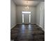 Home foyer showcasing hardwood floors, chandelier, and a front door with sidelights at 1684 Pecan Drive # 43, Nashville, NC 27856