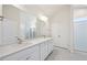 Stylish bathroom with double vanity, modern fixtures, and a tiled walk-in shower at 212 Thunder Forest Ln, Wendell, NC 27591