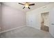 Carpeted bedroom features neutral walls, closet and ceiling fan at 212 Thunder Forest Ln, Wendell, NC 27591