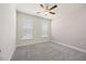 Carpeted bedroom with neutral walls and bright windows at 212 Thunder Forest Ln, Wendell, NC 27591