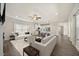 Open-concept living area with lots of natural light and seamless flow into the kitchen at 212 Thunder Forest Ln, Wendell, NC 27591