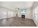 Bright living room with wood floors, fireplace and ceiling fan at 212 Thunder Forest Ln, Wendell, NC 27591
