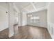 Bright living room with coffered ceilings, hardwood floors, and ample natural light at 212 Thunder Forest Ln, Wendell, NC 27591