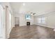 Light-filled living room features fireplace, ceiling fan, and hardwood floors at 212 Thunder Forest Ln, Wendell, NC 27591