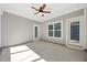 Covered patio featuring a ceiling fan and access to the outdoor living space at 212 Thunder Forest Ln, Wendell, NC 27591