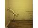 Unfinished basement area with wood-look flooring and exposed pipes at 2602 Fayetteville St, Durham, NC 27707