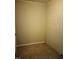 Basement with carpet and light walls, illuminated by overhead lighting at 2602 Fayetteville St, Durham, NC 27707