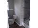 Bathroom featuring a tub and shower with modern fixtures and updated tiling at 2602 Fayetteville St, Durham, NC 27707