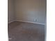 Cozy carpeted bedroom with neutral wall color and ample natural light at 2602 Fayetteville St, Durham, NC 27707