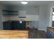 Unfinished kitchen showcasing new butcher block countertops and open shelving at 2602 Fayetteville St, Durham, NC 27707