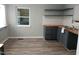Kitchen area featuring new butcher block countertops, gray cabinets, and stainless steel sink at 2602 Fayetteville St, Durham, NC 27707
