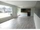 Bright living room with large window and an opening to the kitchen area at 2602 Fayetteville St, Durham, NC 27707