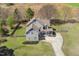 Aerial view of the gray and blue two story home featuring a long driveway and a spacious yard at 288 Joseph Alexander Dr, Fuquay Varina, NC 27526