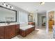 Luxurious bathroom with a soaking tub, double vanity, and ample cabinet space at 288 Joseph Alexander Dr, Fuquay Varina, NC 27526