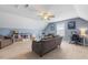 Spacious bonus room with comfortable seating, desk area, and storage shelving for versatile use at 288 Joseph Alexander Dr, Fuquay Varina, NC 27526