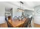 Well-lit dining room boasts hardwood floors and wainscoting, perfect for Gathering meals at 288 Joseph Alexander Dr, Fuquay Varina, NC 27526