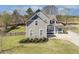 A two story home with a blue trimmed roof, a covered porch, and a spacious yard at 288 Joseph Alexander Dr, Fuquay Varina, NC 27526