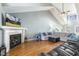 Cozy living room with a fireplace, large sectional sofa, and a vaulted ceiling at 288 Joseph Alexander Dr, Fuquay Varina, NC 27526