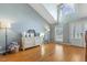 Bright living room with hardwood floors, vaulted ceiling, and large windows at 288 Joseph Alexander Dr, Fuquay Varina, NC 27526