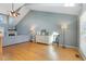 Sunlit living room with hardwood floors, fireplace and large windows at 288 Joseph Alexander Dr, Fuquay Varina, NC 27526
