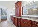 Bright bathroom featuring double vanities, granite countertops and a glass enclosed shower at 301 Kinsale Dr, Chapel Hill, NC 27517