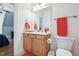 Cozy bathroom featuring a wooden vanity and an adjacent toilet at 301 Kinsale Dr, Chapel Hill, NC 27517