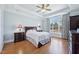 This spacious bedroom features hardwood floors, a tray ceiling, and a large window at 301 Kinsale Dr, Chapel Hill, NC 27517