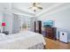 Bedroom with a dresser, hardwood floors, a flat screen TV, and natural light from the window at 301 Kinsale Dr, Chapel Hill, NC 27517