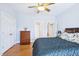 Cozy bedroom featuring a chest of drawers and a soft dark blue bed at 301 Kinsale Dr, Chapel Hill, NC 27517