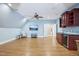 Spacious bonus room features a wet bar, wood floors, ceiling fan, and large tv screen at 301 Kinsale Dr, Chapel Hill, NC 27517
