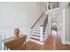 Welcoming foyer with a staircase, hardwood floors, and elegant wainscoting at 301 Kinsale Dr, Chapel Hill, NC 27517
